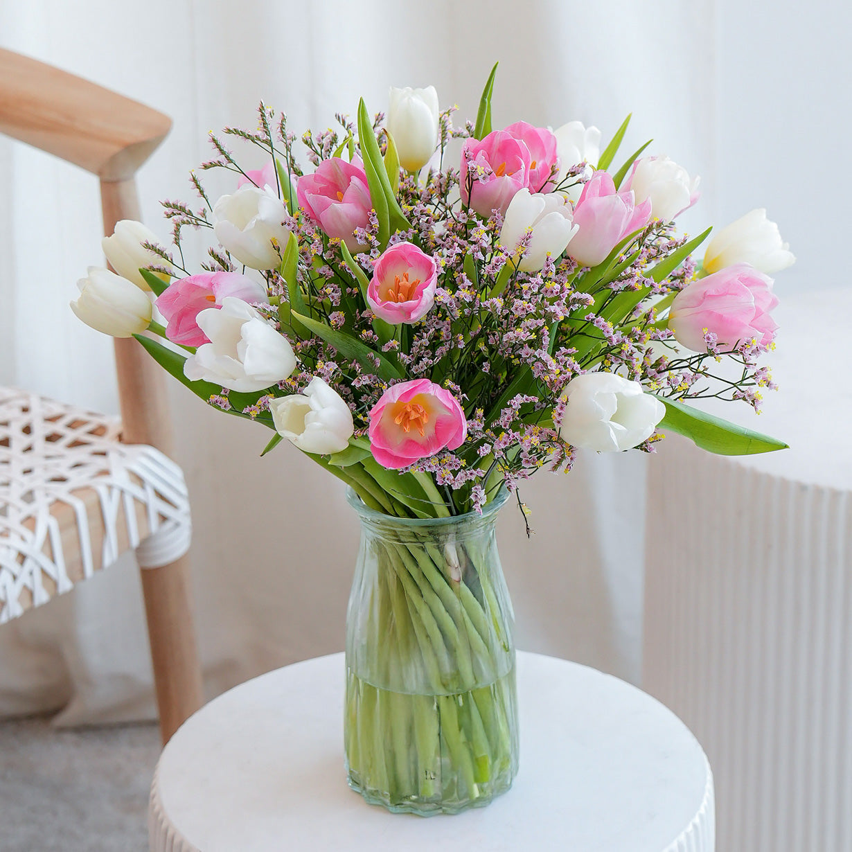 Pink and pink orchid in white vase