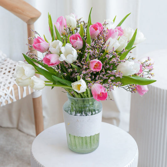 Pink and pink orchid in white vase