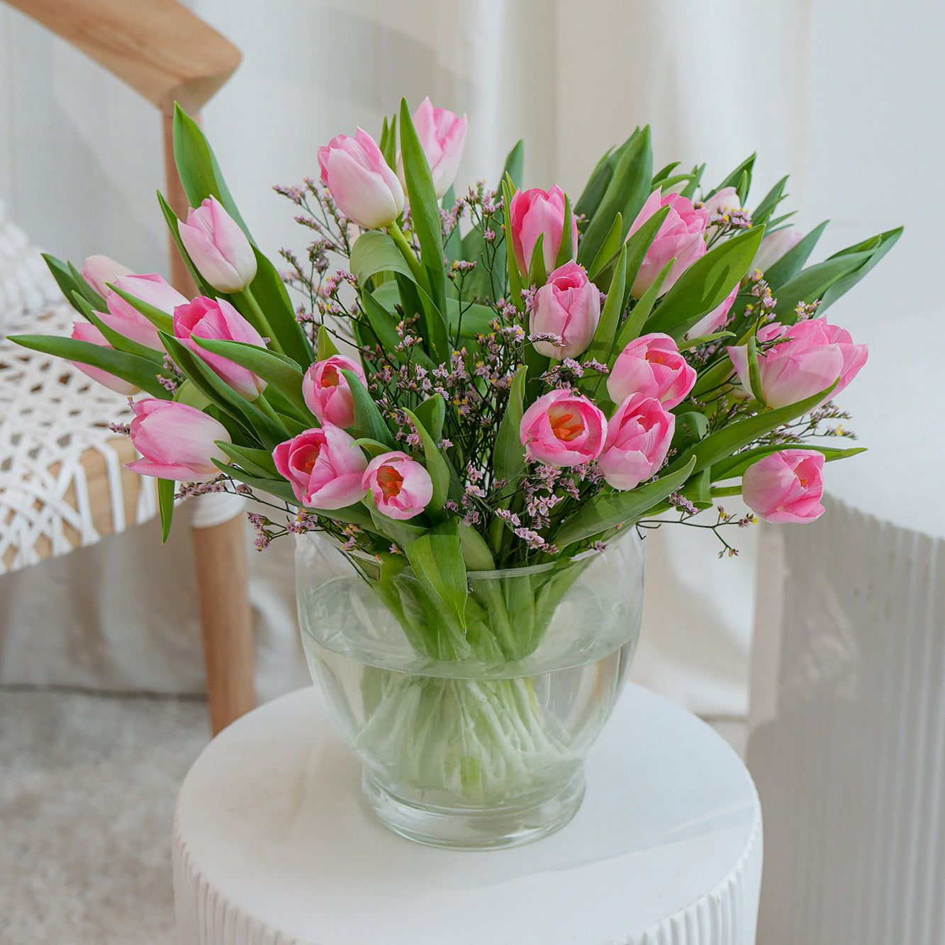 Pink orchid in white vase